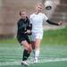 Skyline's Gretchen Bakker-Arkema and Huron's Martha Schmidt run after the ball during the first half of their game, Thursday May 23.
Courtney Sacco I AnnArbor.com   